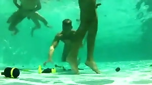 Couple of twink friends fuck in an orgy by the pool